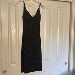 Knee length black sparkle dress with relaxed back